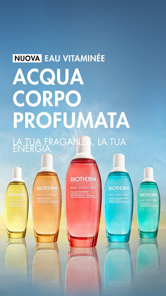 Cinque flaconi colorati di Biotherm Eau Vitaminee allineati su uno sfondo con sfumatura blu e gialla, con il testo: «Nuovo Eau Vitaminee – Acqua Corpo Profumata. La tua fragranza, la tua energia.»