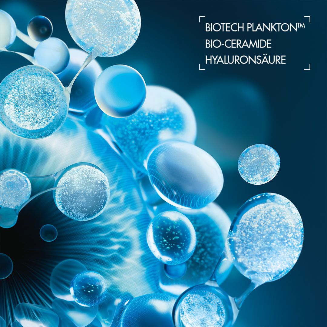 Blaue, leuchtende Blasen schweben in dunkler Umgebung. Text: "MITOCHONDRIEN DIE KRAFTWERKE IHRER ZELLEN".