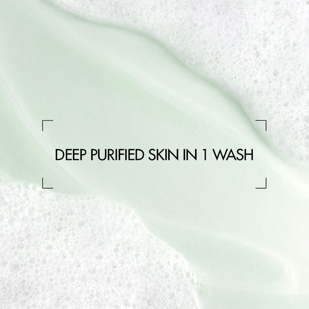 Grune Flussigkeit fließt auf weißem Hintergrund. Text: "DEEP RENEW: SKIN + HAIR".