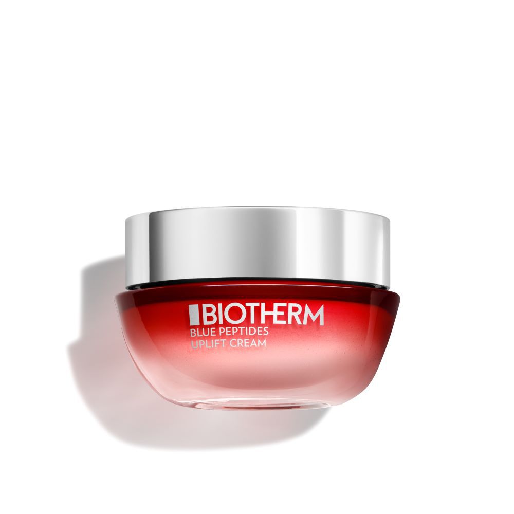 Ein roter Cremetiegel mit silbernem Deckel; darauf steht: BIOTHERM BLUE PEPTIDES UPLIFT CREAM.
